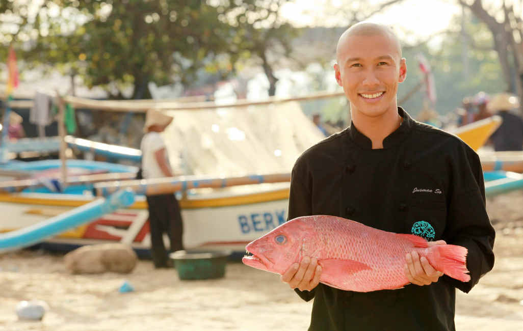 Dava head chef Jusman So selects a fish from the markets at Jimbaran Bay. Dava head chef Jusman So selects a fish from the markets at Jimbaran Bay.